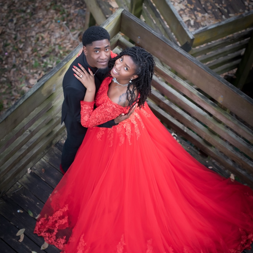 Red lace off the shoulder dress with long train